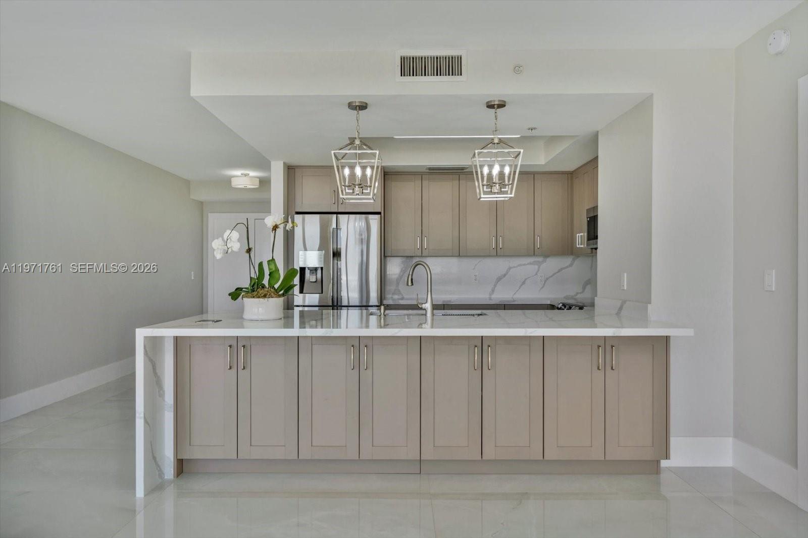 3400 Southwest 27th Avenue, Unit 602 Miami, FL 33133 - Photo 11 of 42 a bathroom with a sink and a mirror