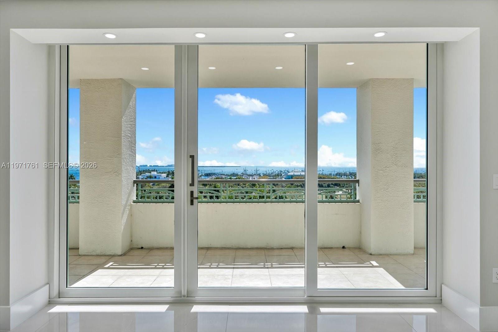3400 Southwest 27th Avenue, Unit 602 Miami, FL 33133 - Photo 15 of 42 a view of a glass door of the house