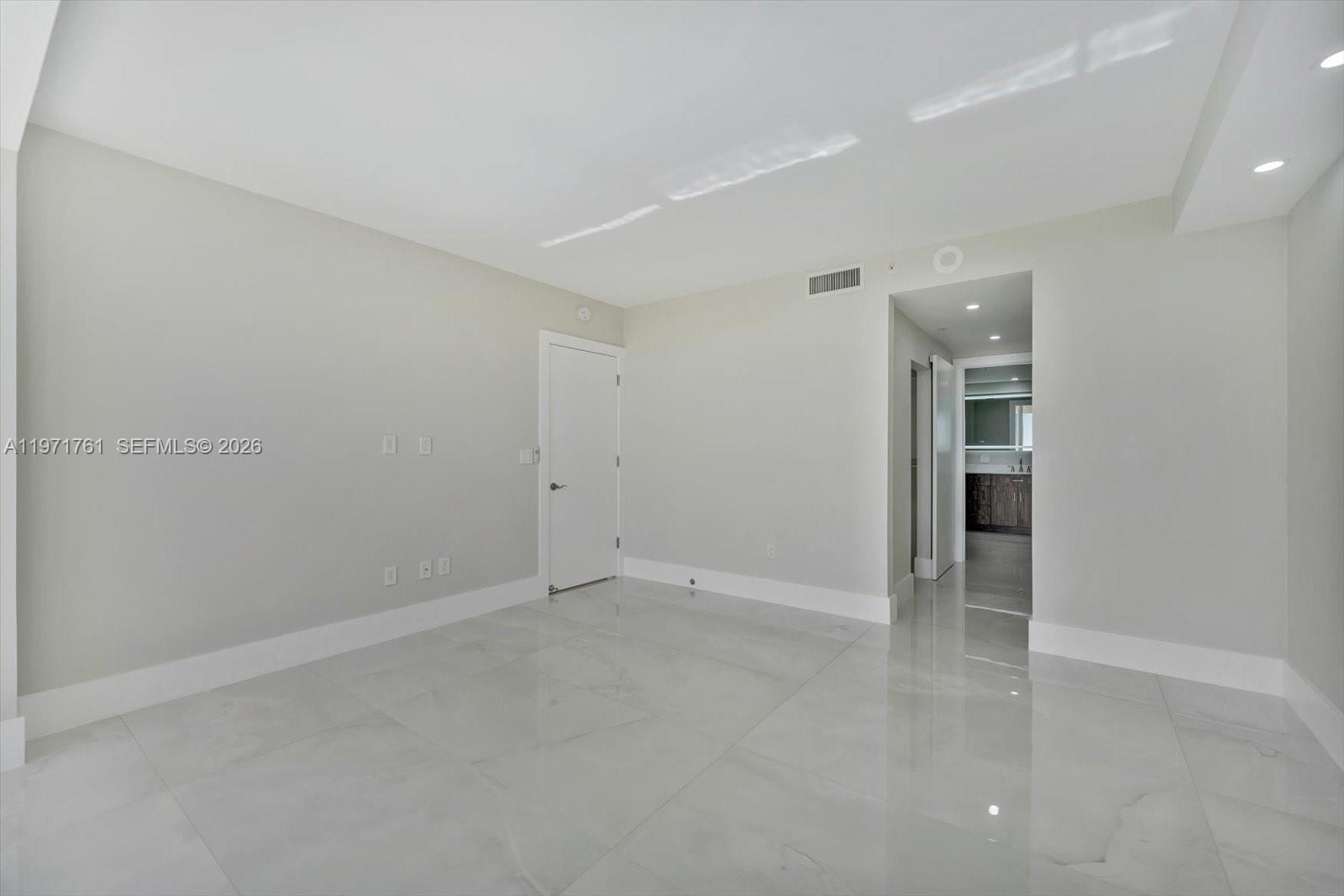3400 Southwest 27th Avenue, Unit 602 Miami, FL 33133 - Photo 19 of 42 wooden floor in an empty room
