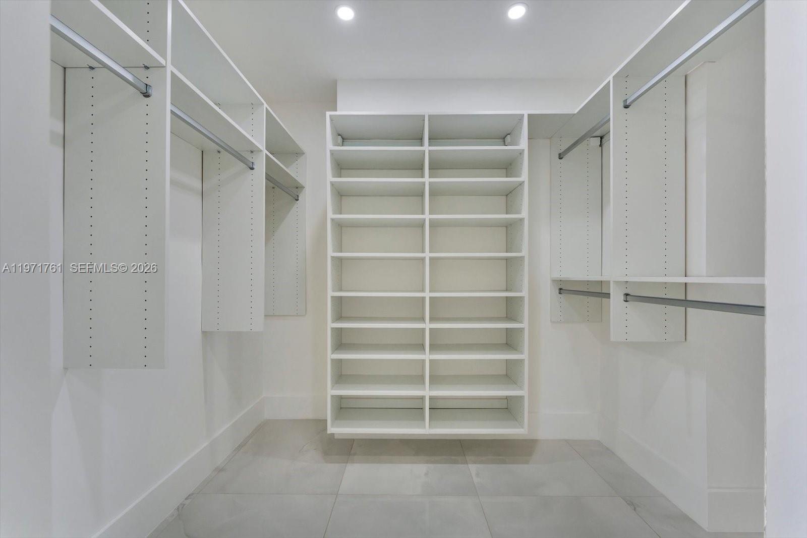 3400 Southwest 27th Avenue, Unit 602 Miami, FL 33133 - Photo 22 of 42 a view of walk in closet with empty racks
