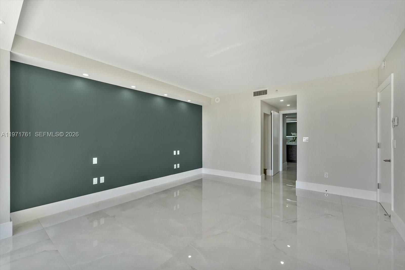 3400 Southwest 27th Avenue, Unit 602 Miami, FL 33133 - Photo 27 of 42 an empty room with closet and windows