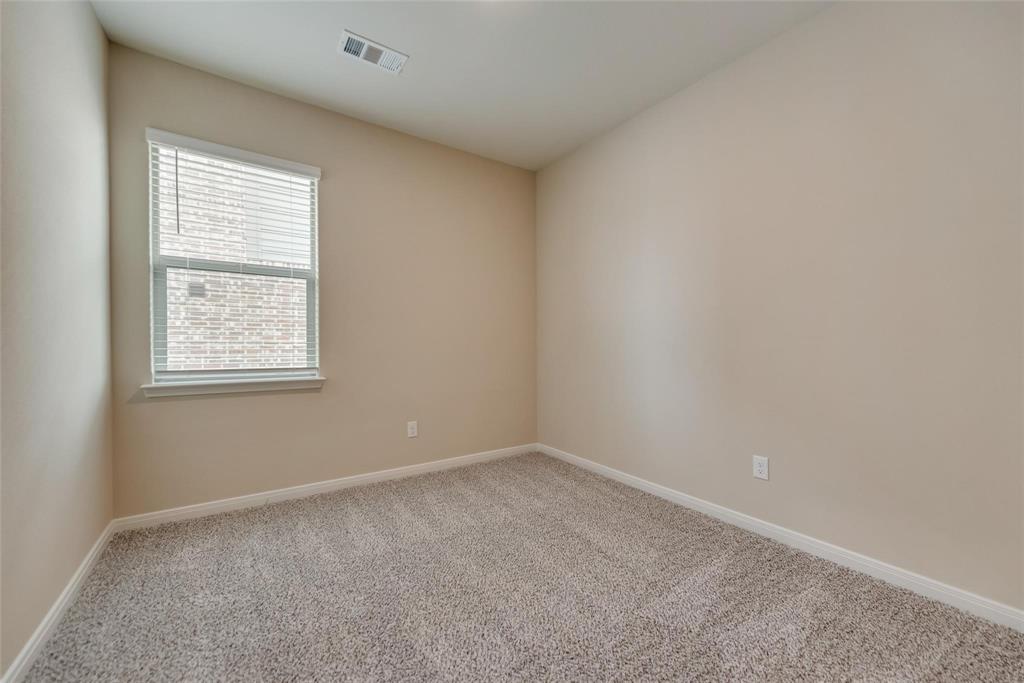 291 Wandering Stream Way Princeton, TX 75407 - Photo 12 of 22 an empty room with a window