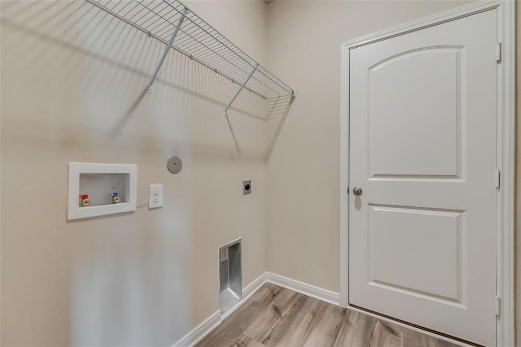 291 Wandering Stream Way Princeton, TX 75407 - Photo 13 of 22 a view of a room with wooden floor