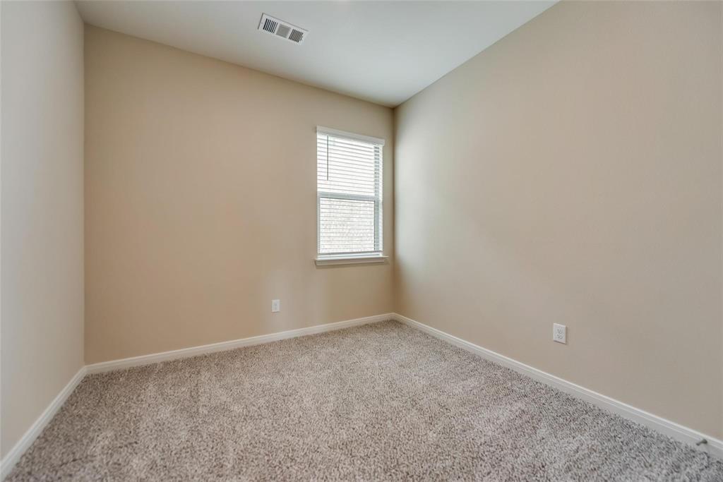 291 Wandering Stream Way Princeton, TX 75407 - Photo 14 of 22 an empty room with windows