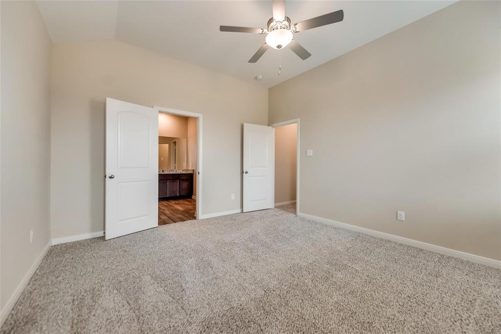 291 Wandering Stream Way Princeton, TX 75407 - Photo 16 of 22 a view of empty room with a ceiling fan