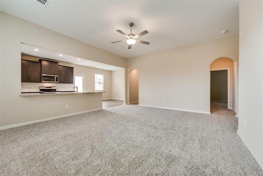 291 Wandering Stream Way Princeton, TX 75407 - Photo 5 of 22 a view of a livingroom with a flat screen tv