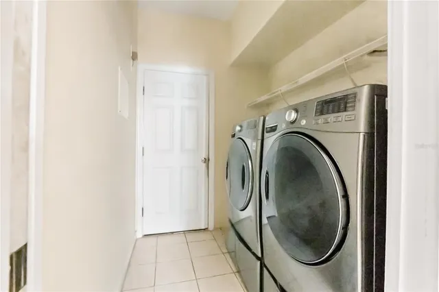 a utility room with dryer and washer