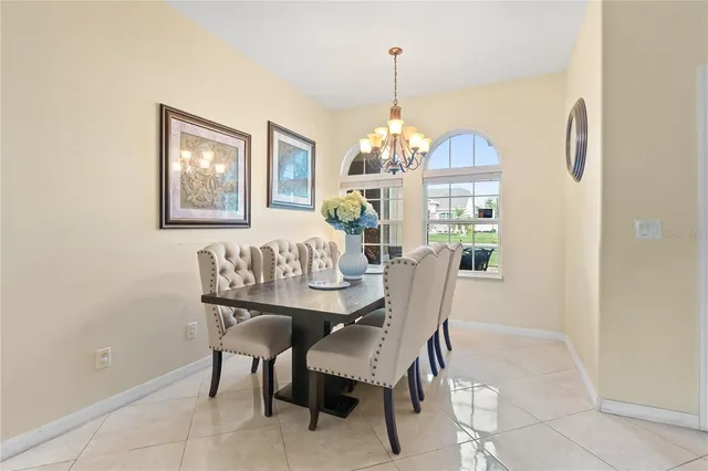 a view of a dining room with furniture window and chandelier