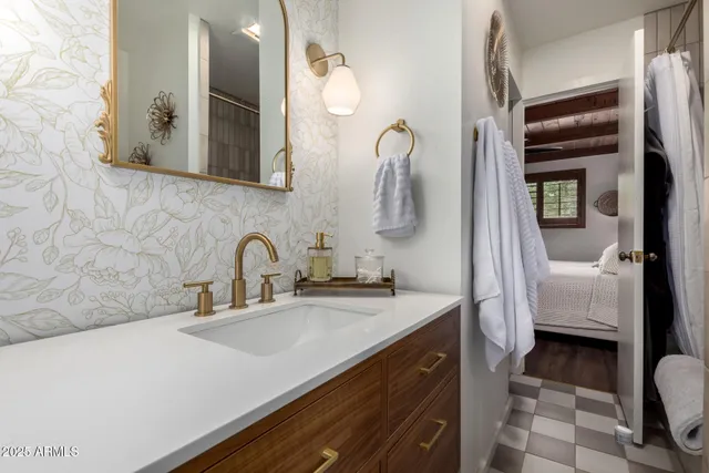 a bathroom with a sink and a mirror