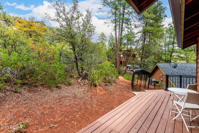 a view of a wooden deck with furniture