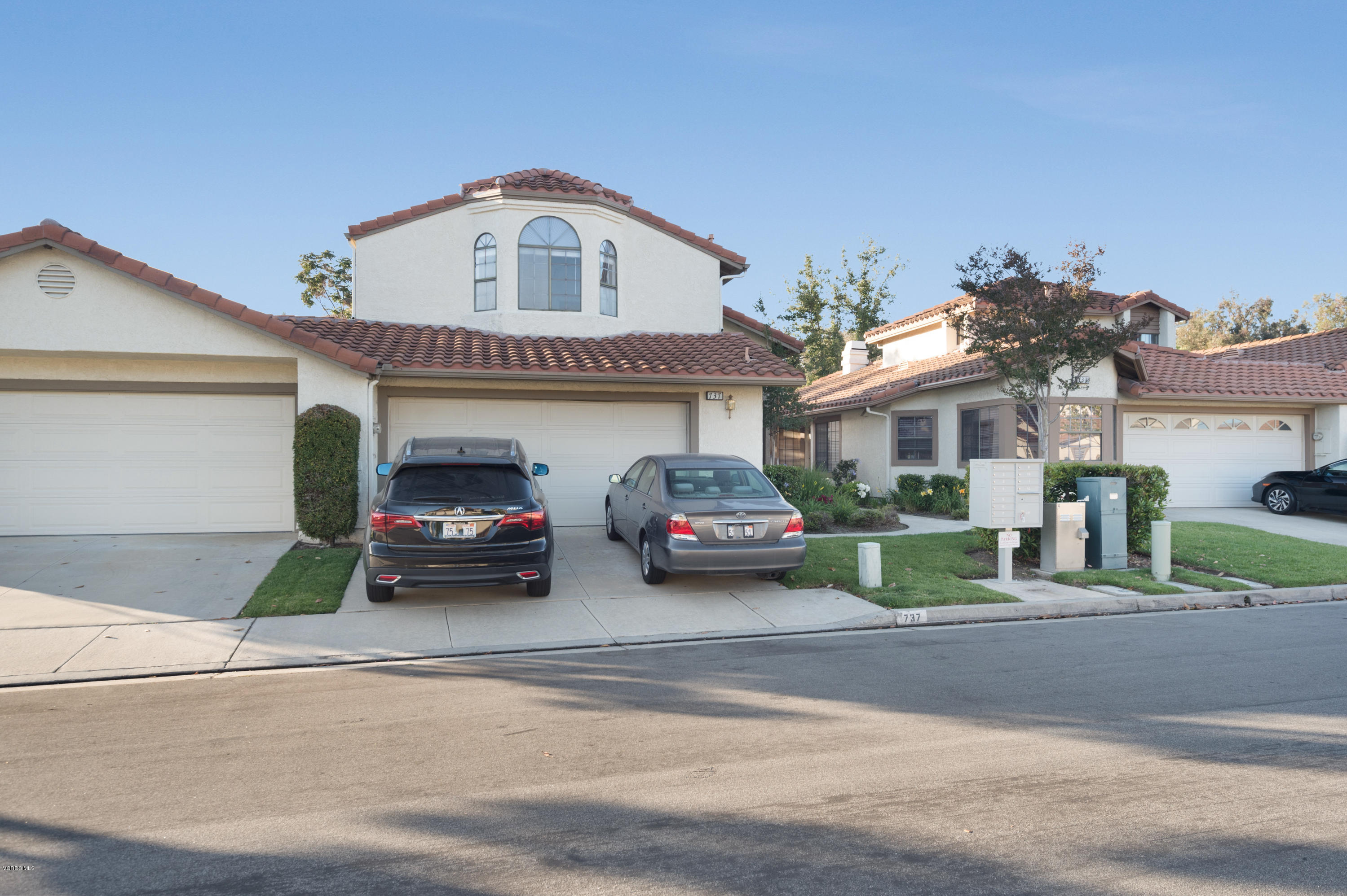 737 Congressional Road Simi Valley, CA 93065 - Photo 1 of 18 a view of a cars park in front of a house