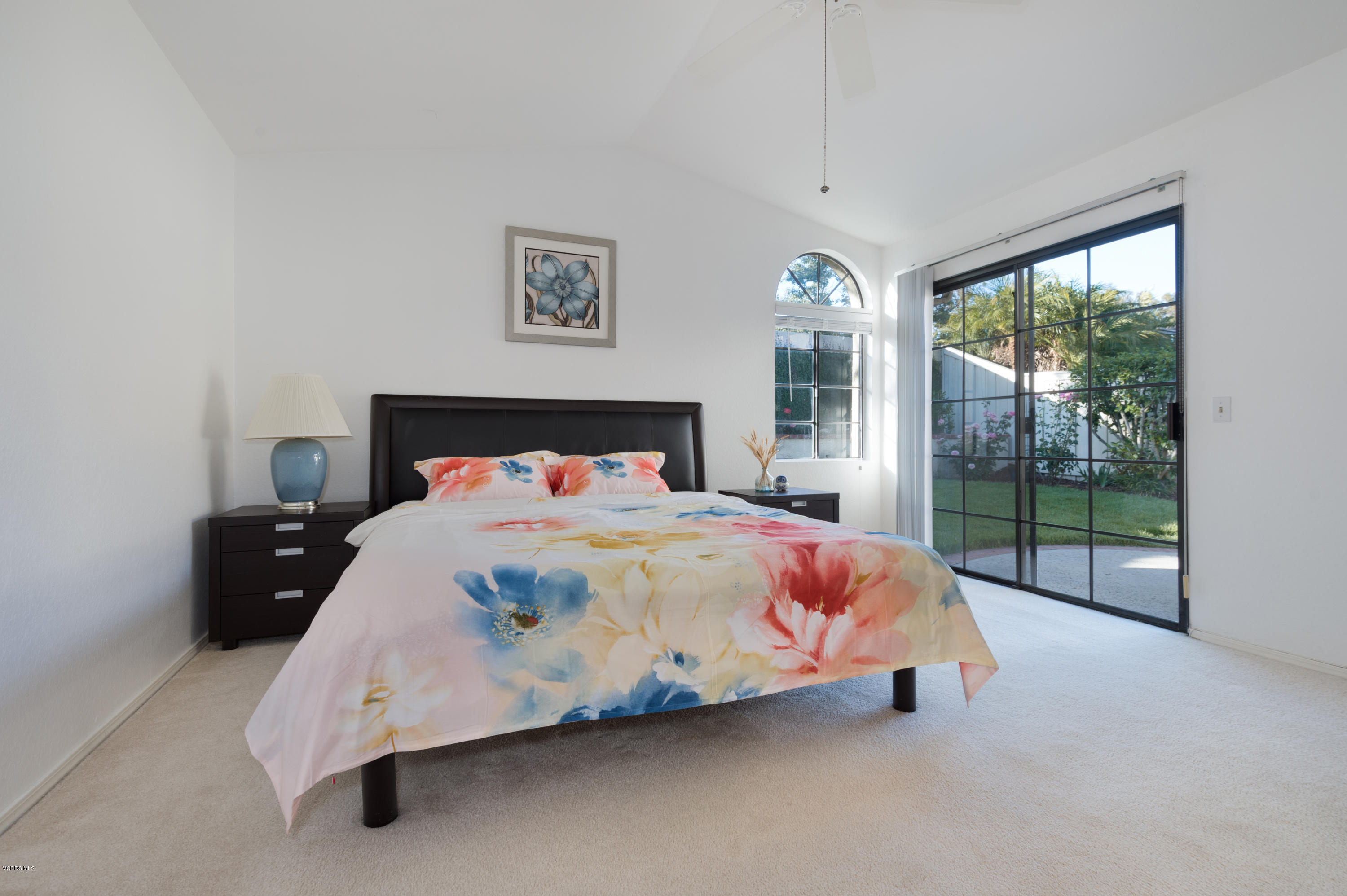737 Congressional Road Simi Valley, CA 93065 - Photo 12 of 18 a spacious bedroom with a bed and glass door