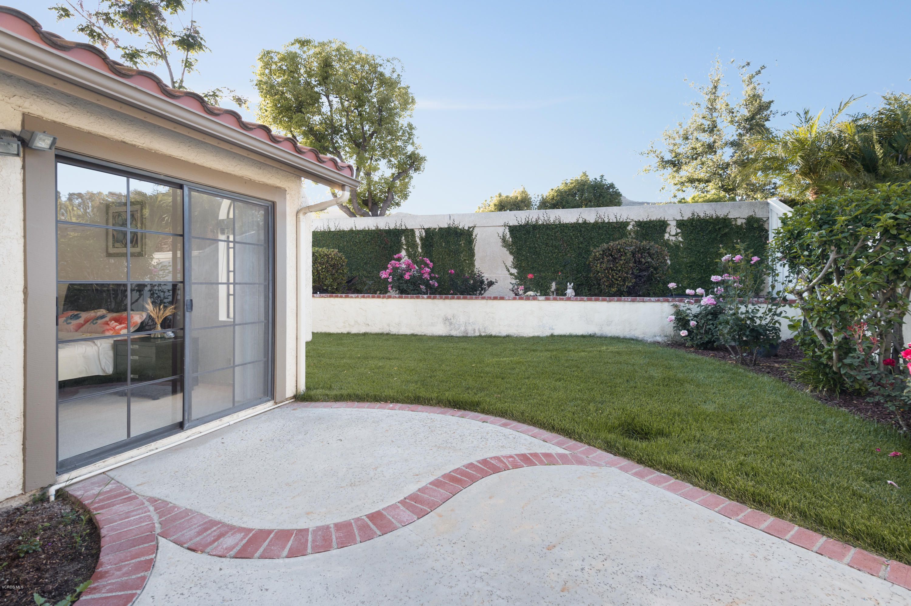 737 Congressional Road Simi Valley, CA 93065 - Photo 16 of 18 a view of a backyard with a garden and plants