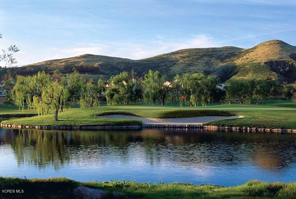 737 Congressional Road Simi Valley, CA 93065 - Photo 17 of 18 a view of a lake with a mountain in the background