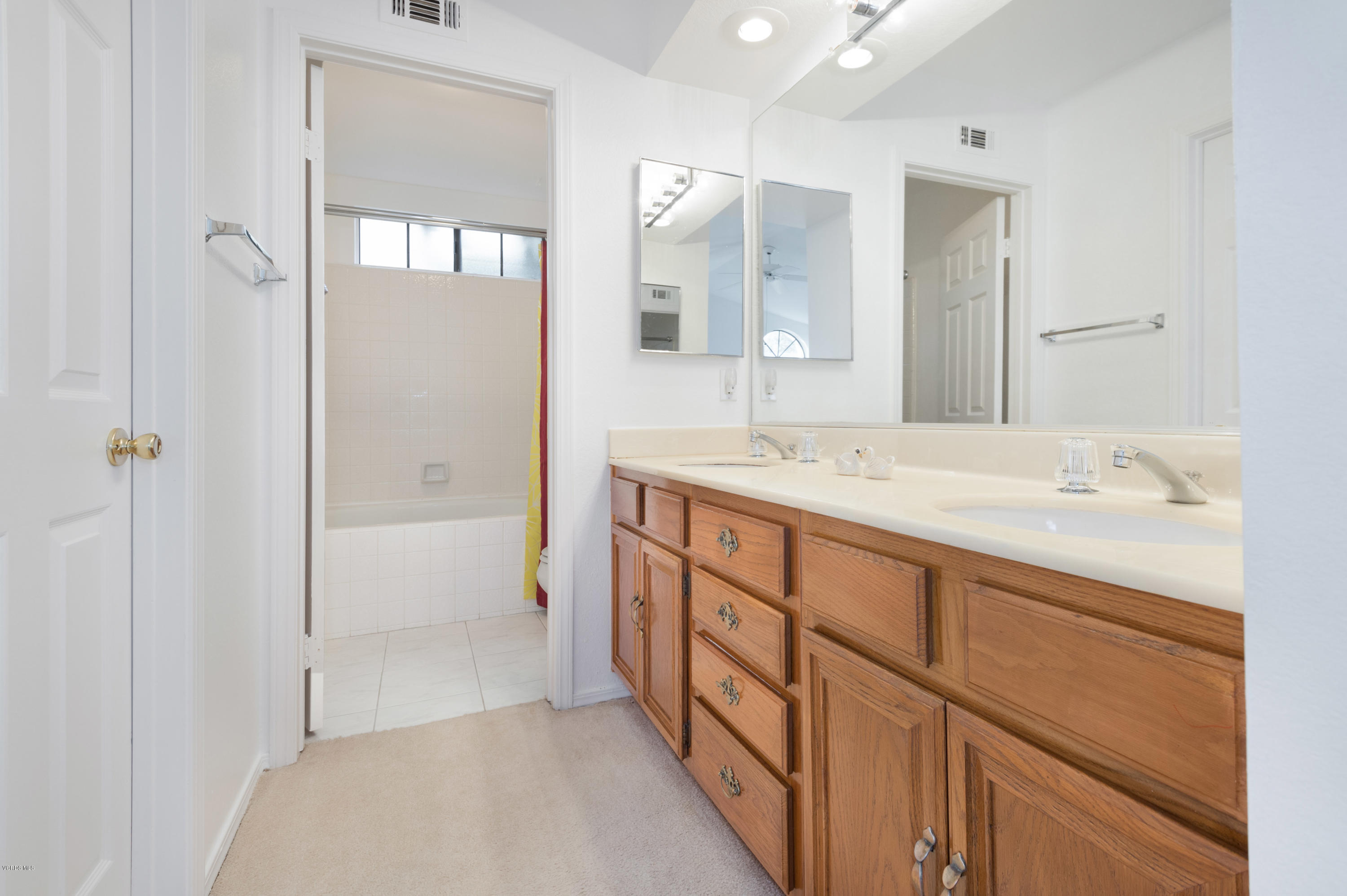 737 Congressional Road Simi Valley, CA 93065 - Photo 18 of 18 a spacious bathroom with a shower sink and mirror