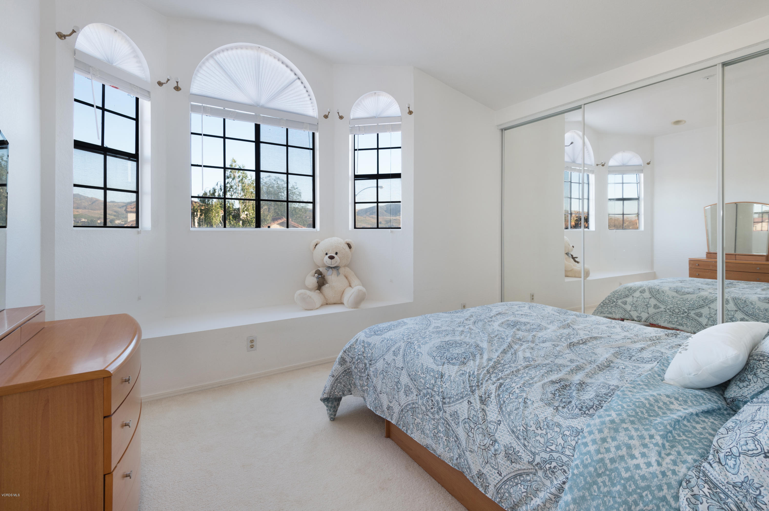 737 Congressional Road Simi Valley, CA 93065 - Photo 10 of 18 a spacious bedroom with a bed a dresser and windows