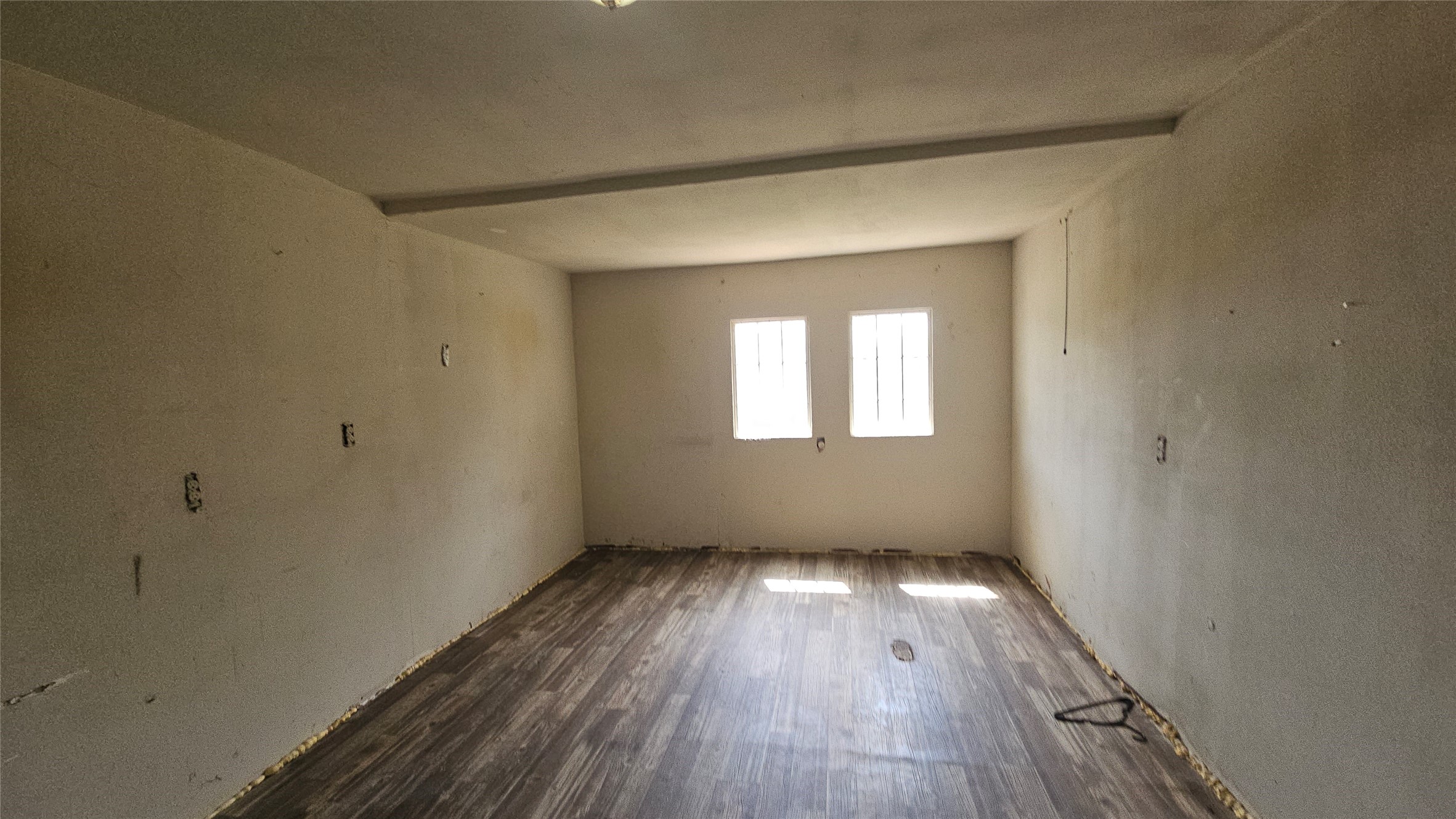 6502 West Montgomery Road Houston, TX 77091 - Photo 5 of 6 a view of an empty room with wooden floor and a window