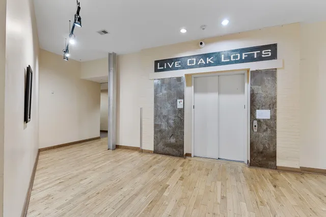 a view of a hallway with closet area