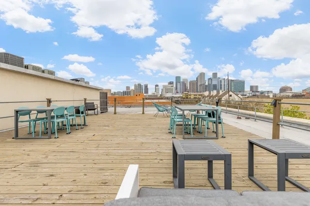 a view of roof deck with patio
