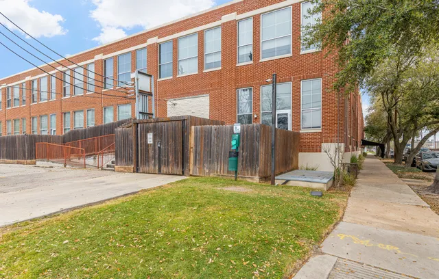 a view of a building with a yard