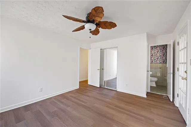 a view of a room with wooden floor and cabinet