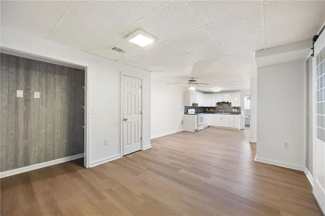 a view of a kitchen with wooden floor