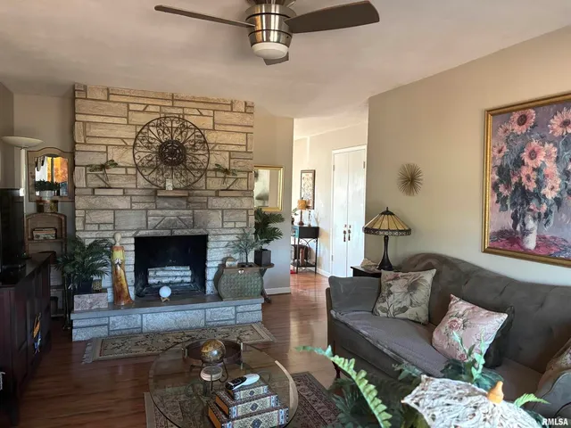 a living room with furniture and a fireplace