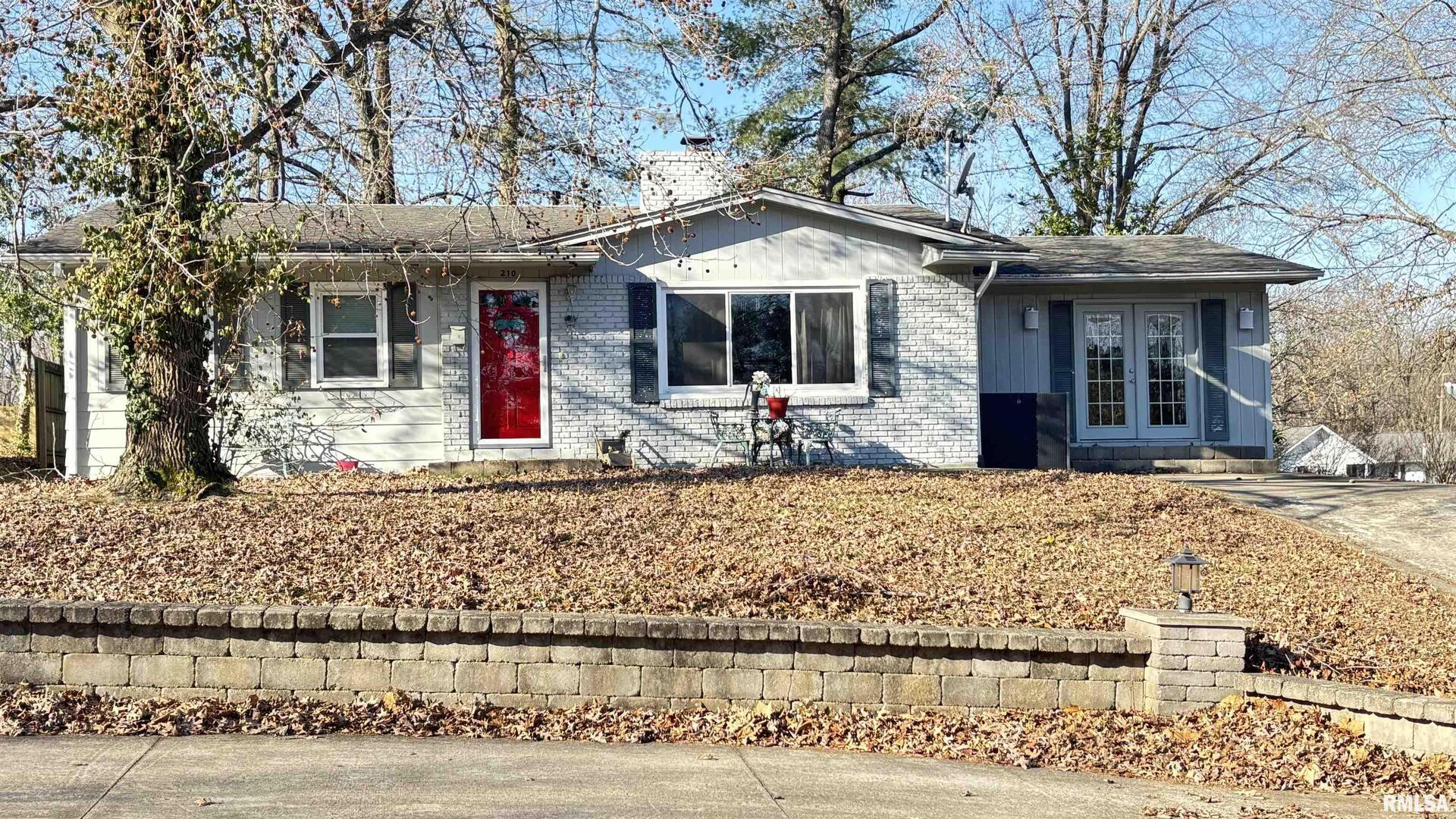 210 Apple Lane Anna, IL 62906 - Photo 2 of 45 a front view of a house with garden