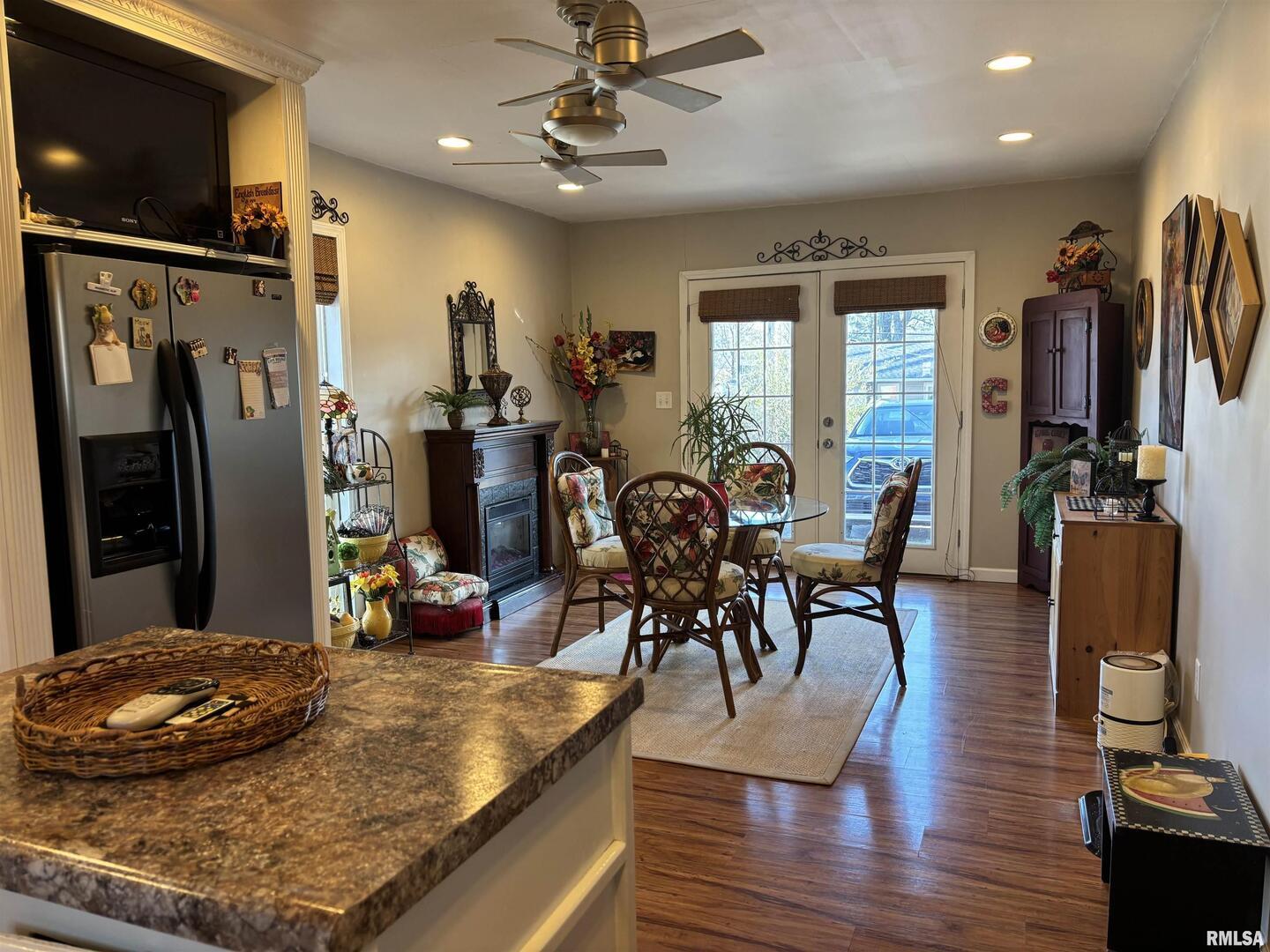 210 Apple Lane Anna, IL 62906 - Photo 21 of 45 a room with lots of chairs and wooden floor