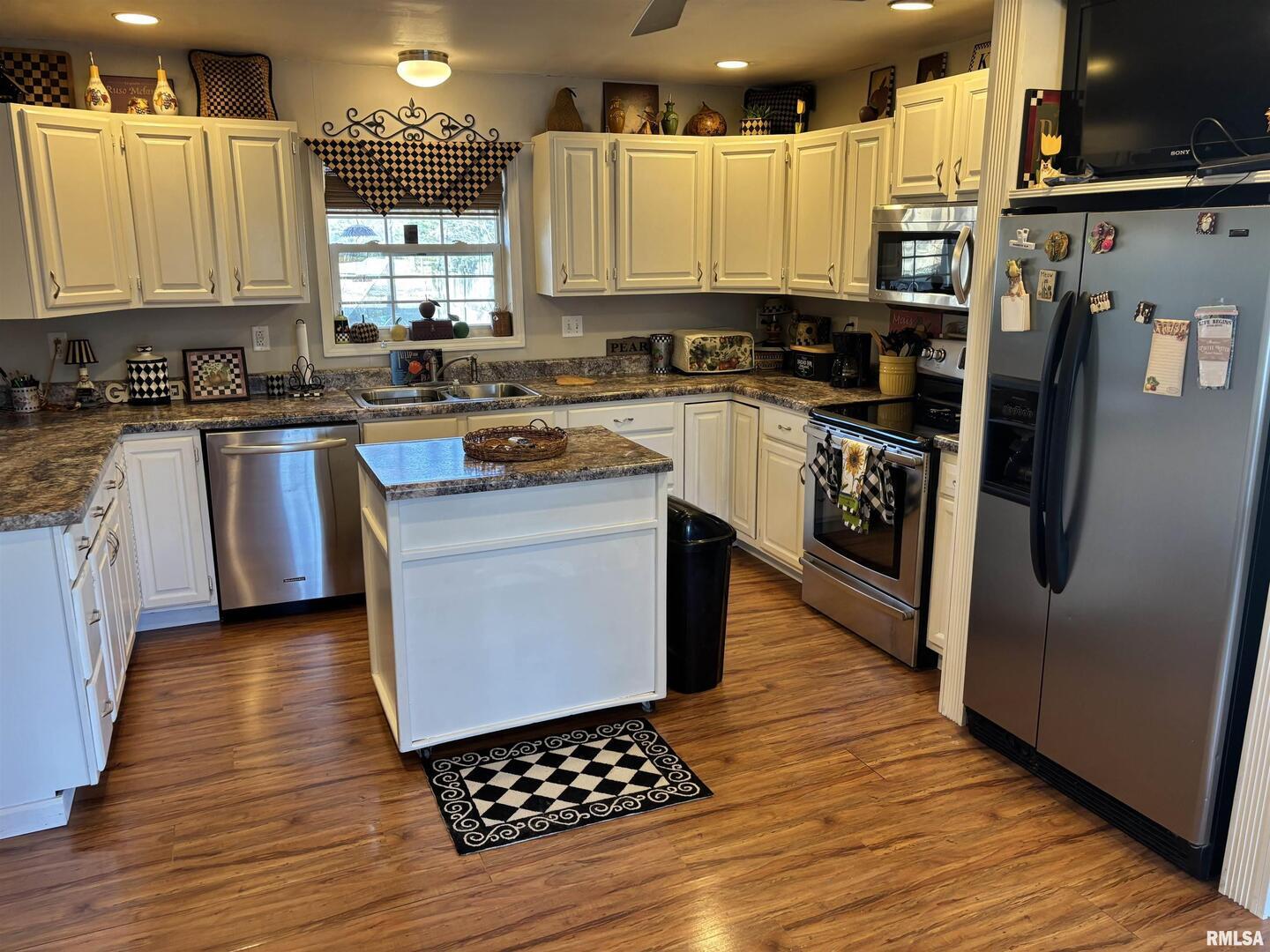210 Apple Lane Anna, IL 62906 - Photo 23 of 45 a kitchen with stainless steel appliances a refrigerator sink and cabinets