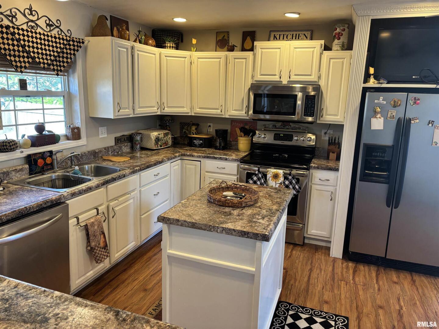 210 Apple Lane Anna, IL 62906 - Photo 25 of 45 a kitchen with stainless steel appliances a stove a sink and a microwave