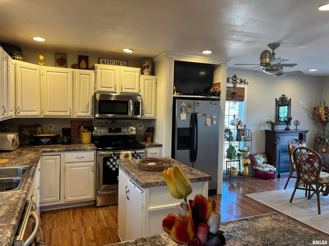 a kitchen with a stove a sink and a refrigerator