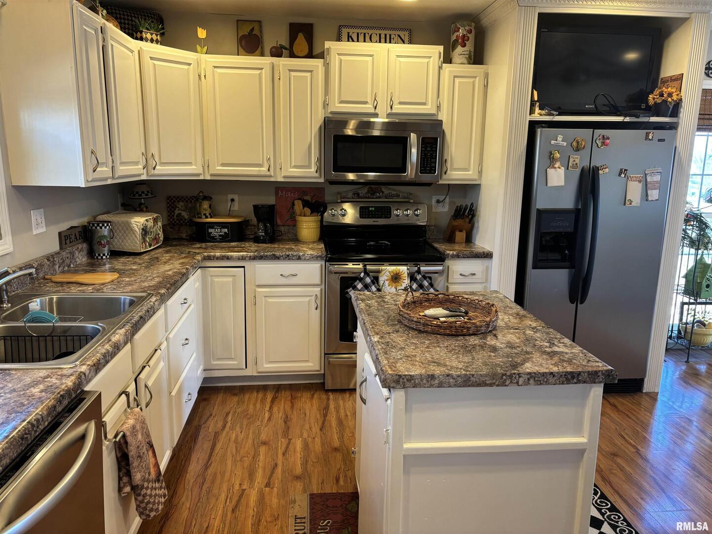 210 Apple Lane Anna, IL 62906 - Photo 27 of 45 a kitchen with stainless steel appliances granite countertop a stove a sink and a microwave