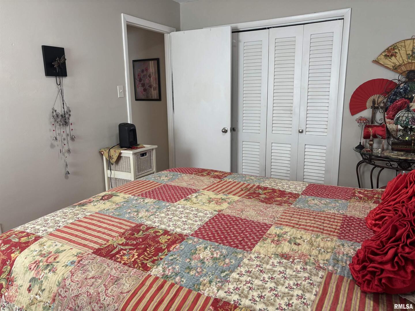 210 Apple Lane Anna, IL 62906 - Photo 30 of 45 a bedroom with a bed and dresser with wooden floor