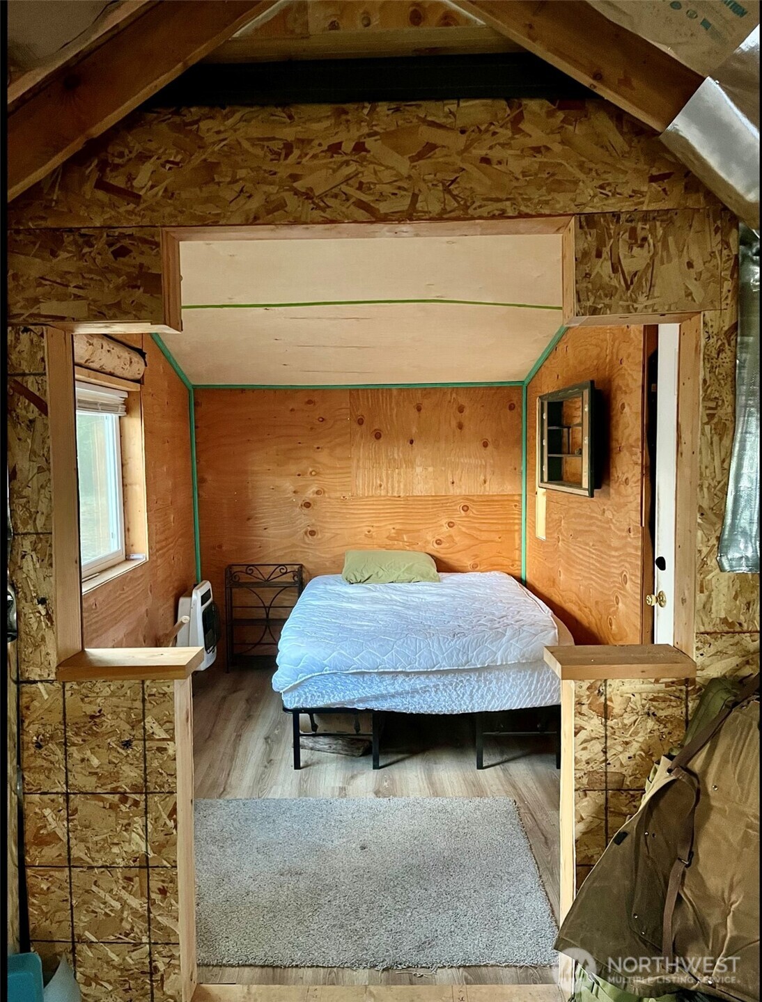 315 Reevas Basin Road Tonasket, WA 98855 - Photo 11 of 25 a bedroom with a bed and window