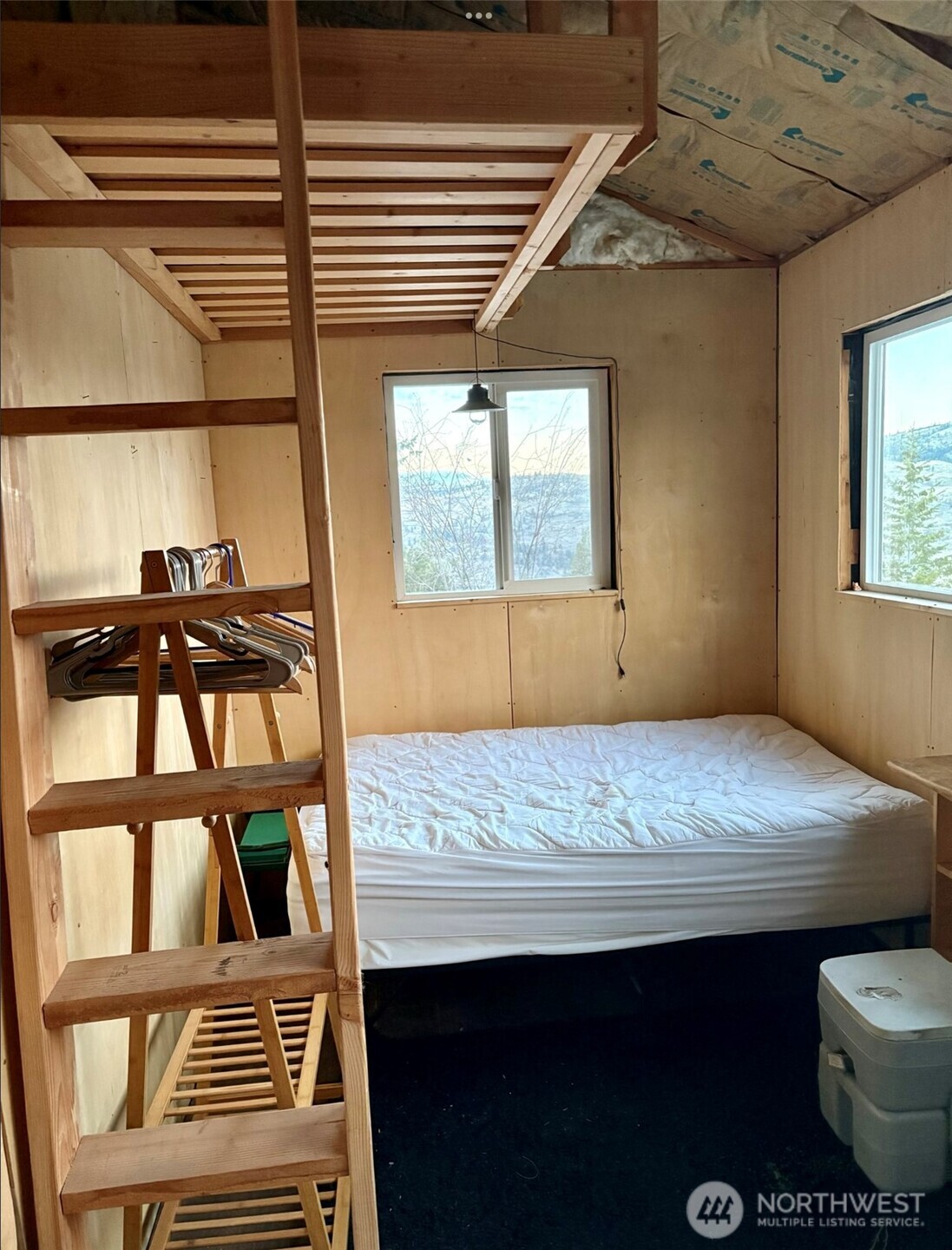 315 Reevas Basin Road Tonasket, WA 98855 - Photo 17 of 25 a view of a room with window and wooden floor