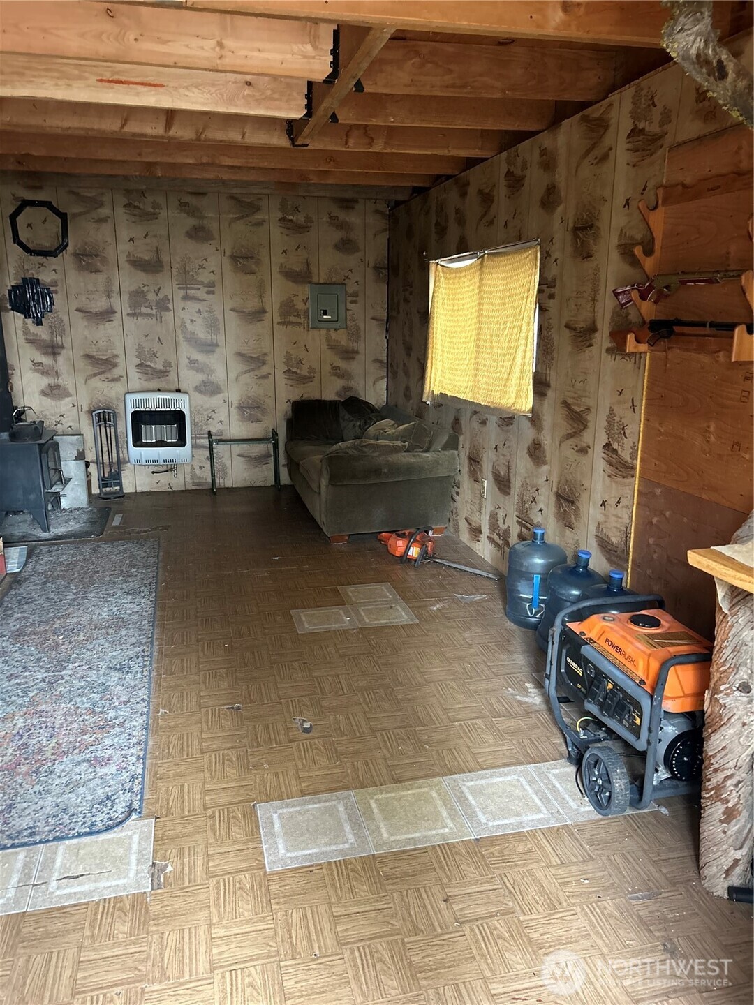 315 Reevas Basin Road Tonasket, WA 98855 - Photo 7 of 25 a living room with furniture a fireplace and a flat screen tv