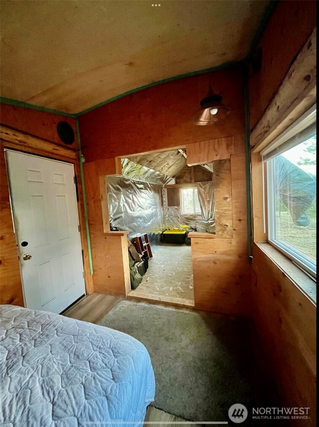 315 Reevas Basin Road Tonasket, WA 98855 - Photo 10 of 25 a bedroom with a bed and window