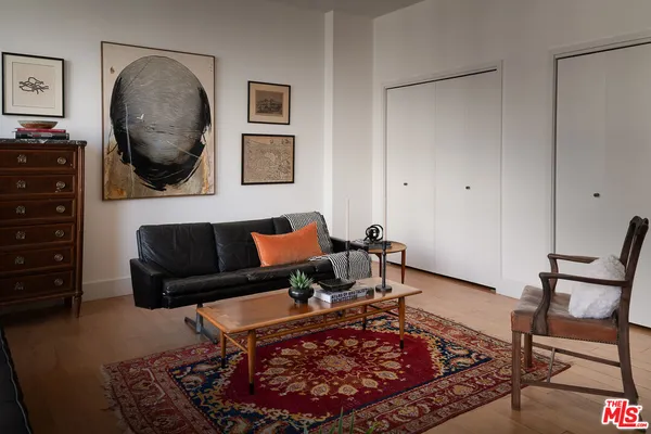 a living room with furniture and a rug