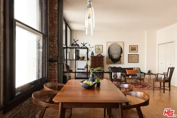 a view of a dining room with furniture and chandelier