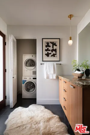 a kitchen with a stove a sink and a refrigerator