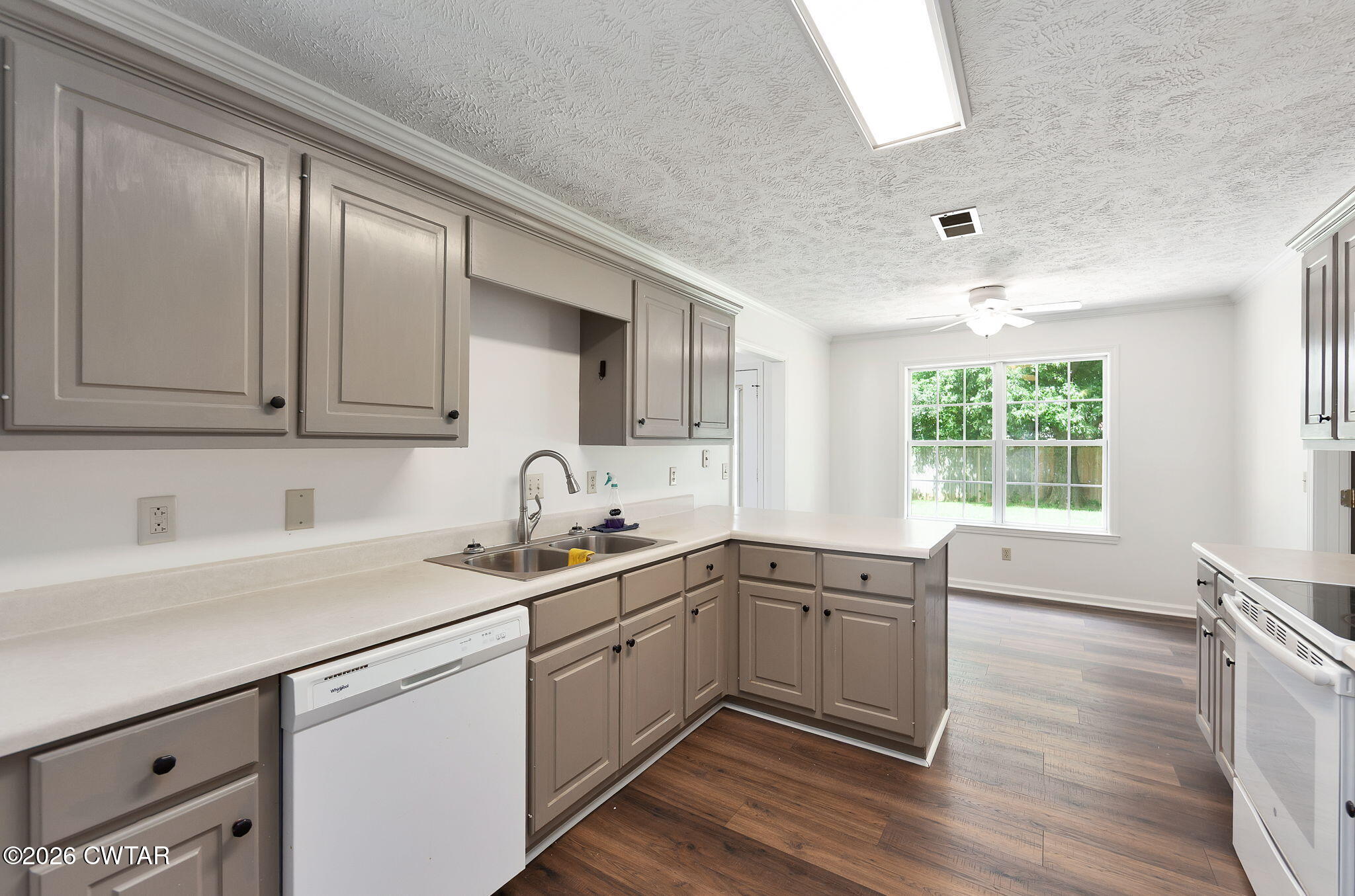 96 Sundown Drive Jackson, TN 38305 - Photo 8 of 28 a kitchen with a sink window and cabinets