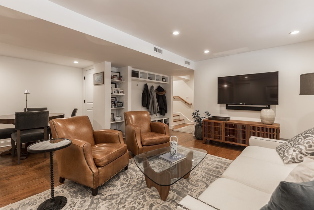 135 University Road, Unit 1 Brookline, MA 02445 - Photo 13 of 18 a living room with furniture and a flat screen tv