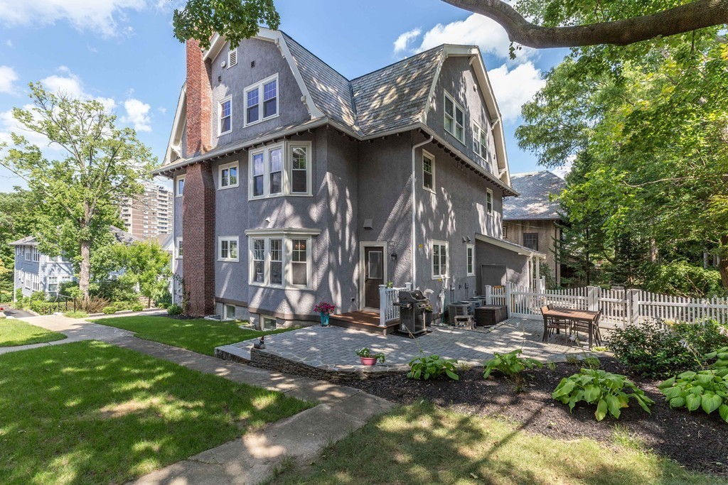 135 University Road, Unit 1 Brookline, MA 02445 - Photo 14 of 18 a view of a building with a yard