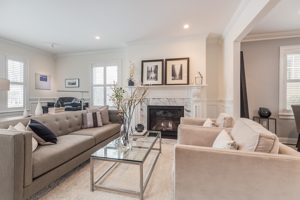 135 University Road, Unit 1 Brookline, MA 02445 - Photo 2 of 18 a living room with furniture and a fireplace