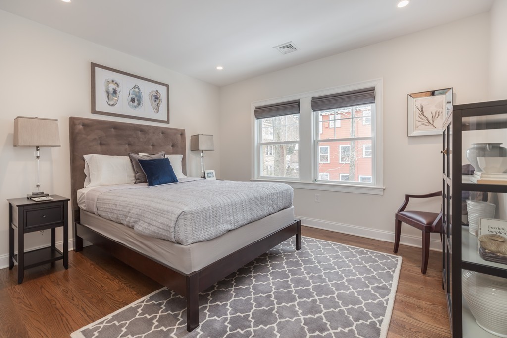 135 University Road, Unit 1 Brookline, MA 02445 - Photo 10 of 18 a bedroom with a bed and a window