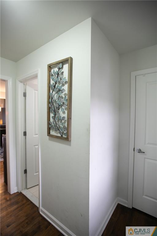 4308 Hana Road Edison, NJ 08817 - Photo 2 of 32 a view of hallway with wooden floor
