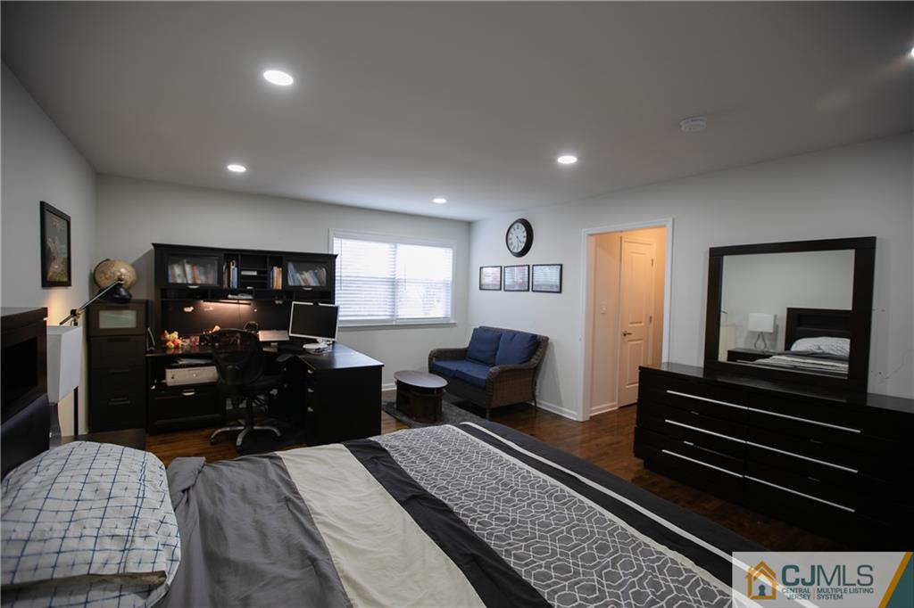 4308 Hana Road Edison, NJ 08817 - Photo 22 of 32 a bedroom with furniture and wooden floor