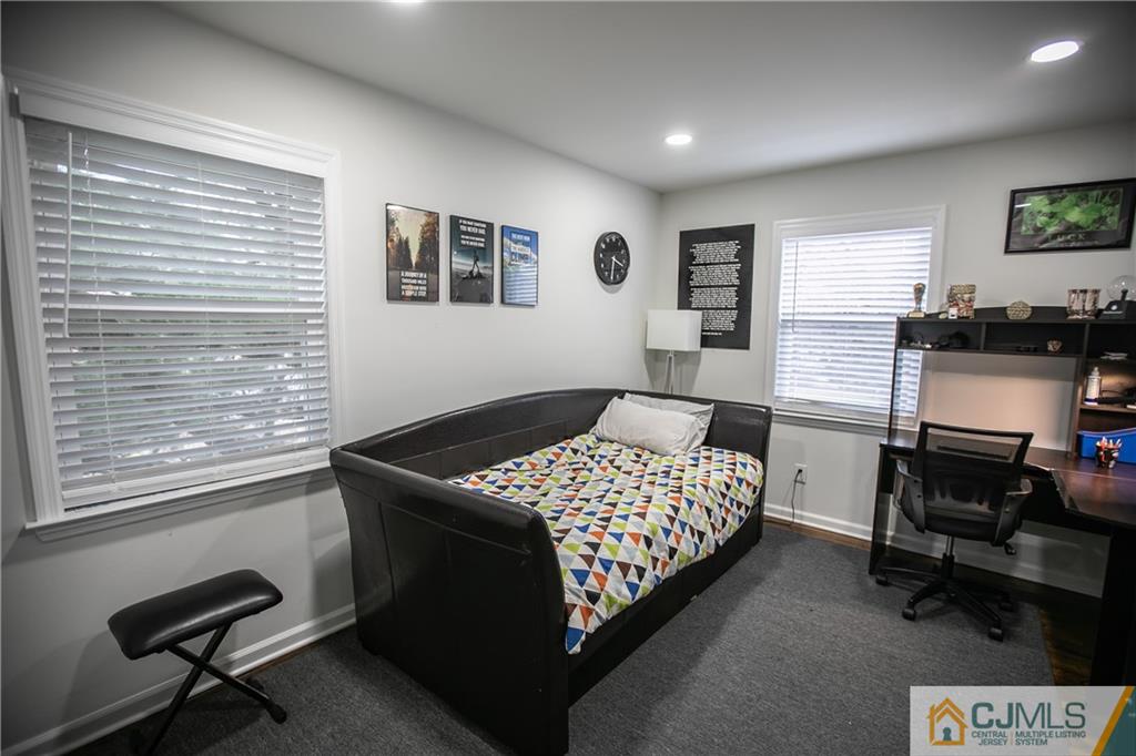 4308 Hana Road Edison, NJ 08817 - Photo 26 of 32 a bedroom with a bed and furniture