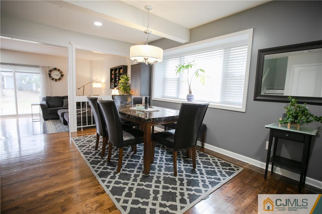 4308 Hana Road Edison, NJ 08817 - Photo 4 of 32 a view of a a dining room with furniture window and wooden floor